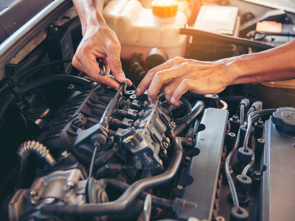Automotive technician working in a repair shop